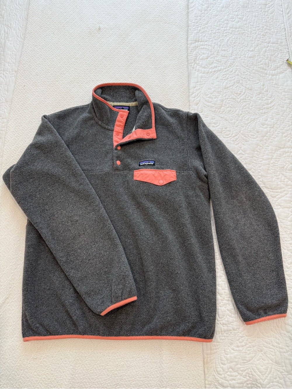 Patagonia Synchilla Snap-T Fleece in charcoal grey and coral